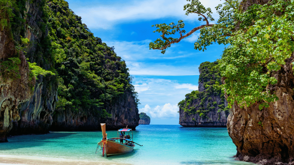 Scenic view of Maya Bay with turquoise water, white sand, and limestone cliffs in Phi Phi Islands, Thailand


