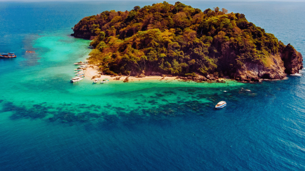 Tranquil view of Radhanagar Beach with white sand, clear turquoise water, and lush tropical forest in Havelock Island, India

