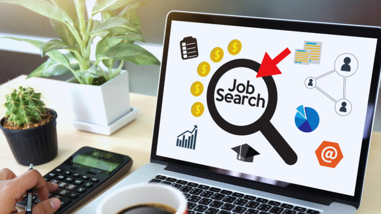 Person browsing taaza job online on a laptop while holding a coffee cup in a café